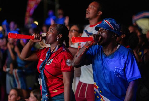 Fans of the Cape Verde national soccer team celebrate as they watch a World Cup group stage match against Uruguay in Praia