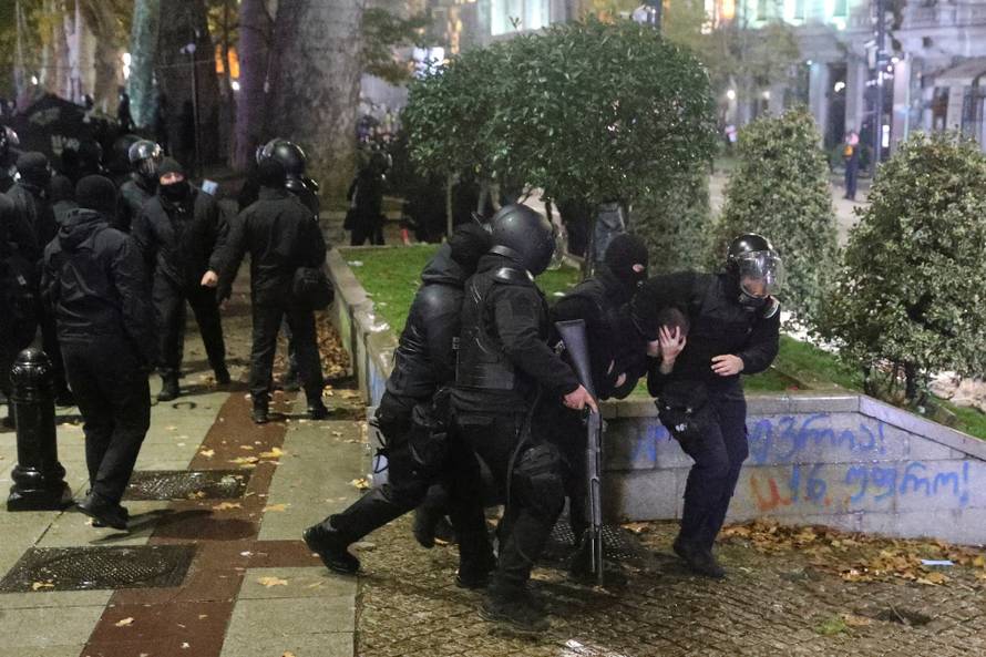 Supporters of Georgia's opposition attend a rally to protest, after government halts EU application until 2028, in Tbilisi