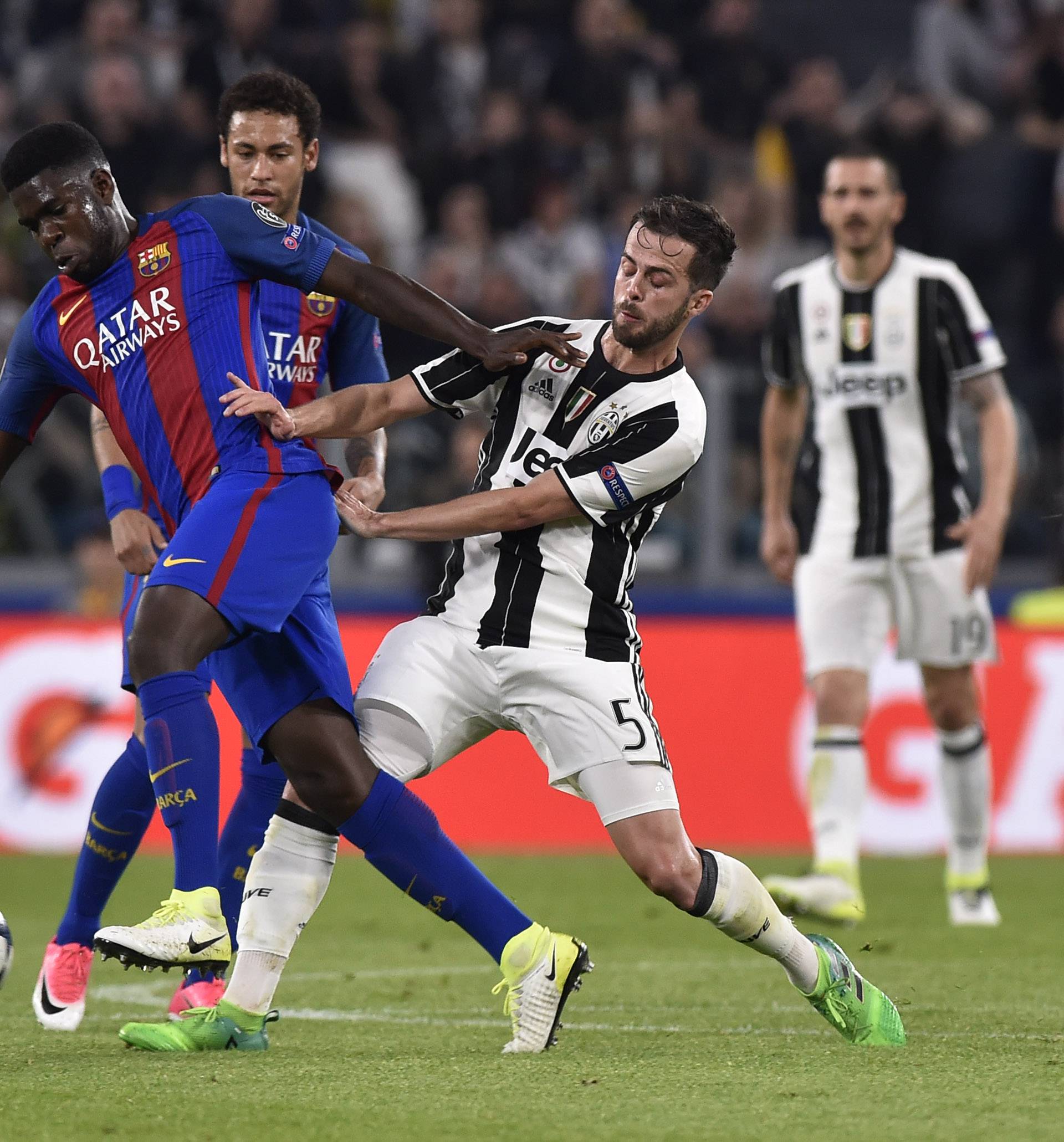 Juventus' Miralem Pjanic in action with Barcelona's Samuel Umtiti
