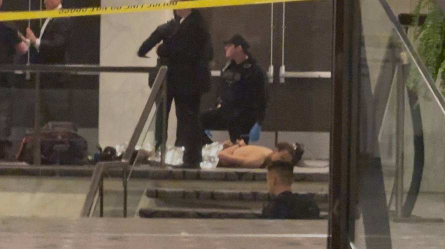 Law enforcement personnel detain Cole Tomas Allen, a suspect in the shooting incident at the White House Correspondents' Association dinner, in Washington
