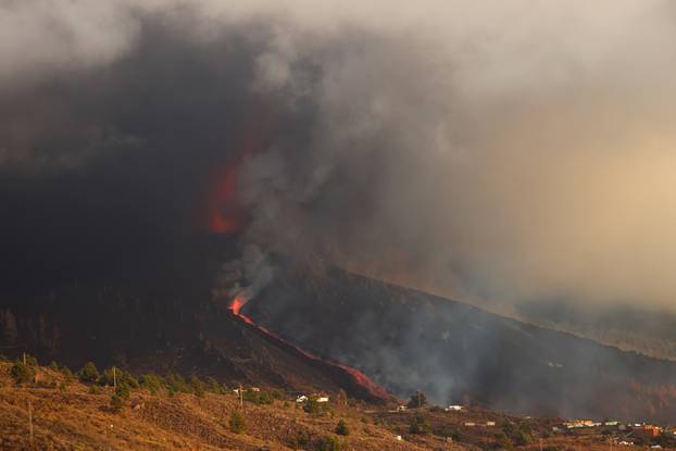 Smoke rises following the eruption of a volcano in Tajuya