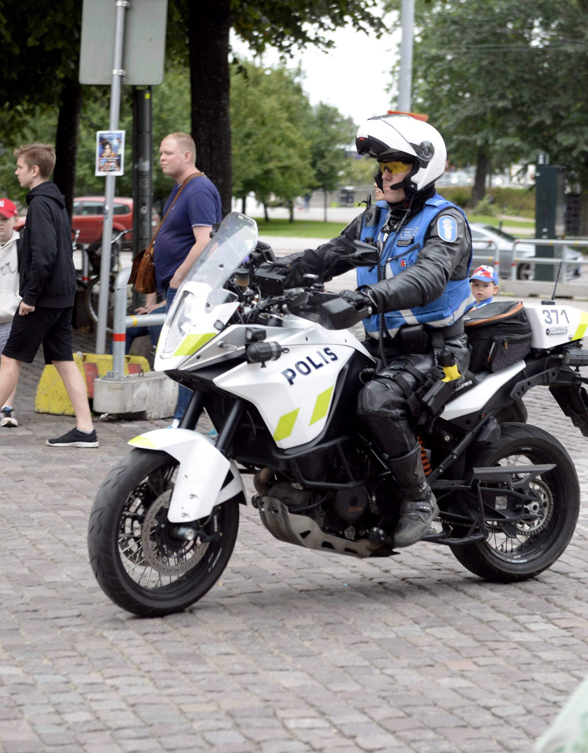 Finnish police patrols on motorbike after stabbings in Turku, in Central Helsinki