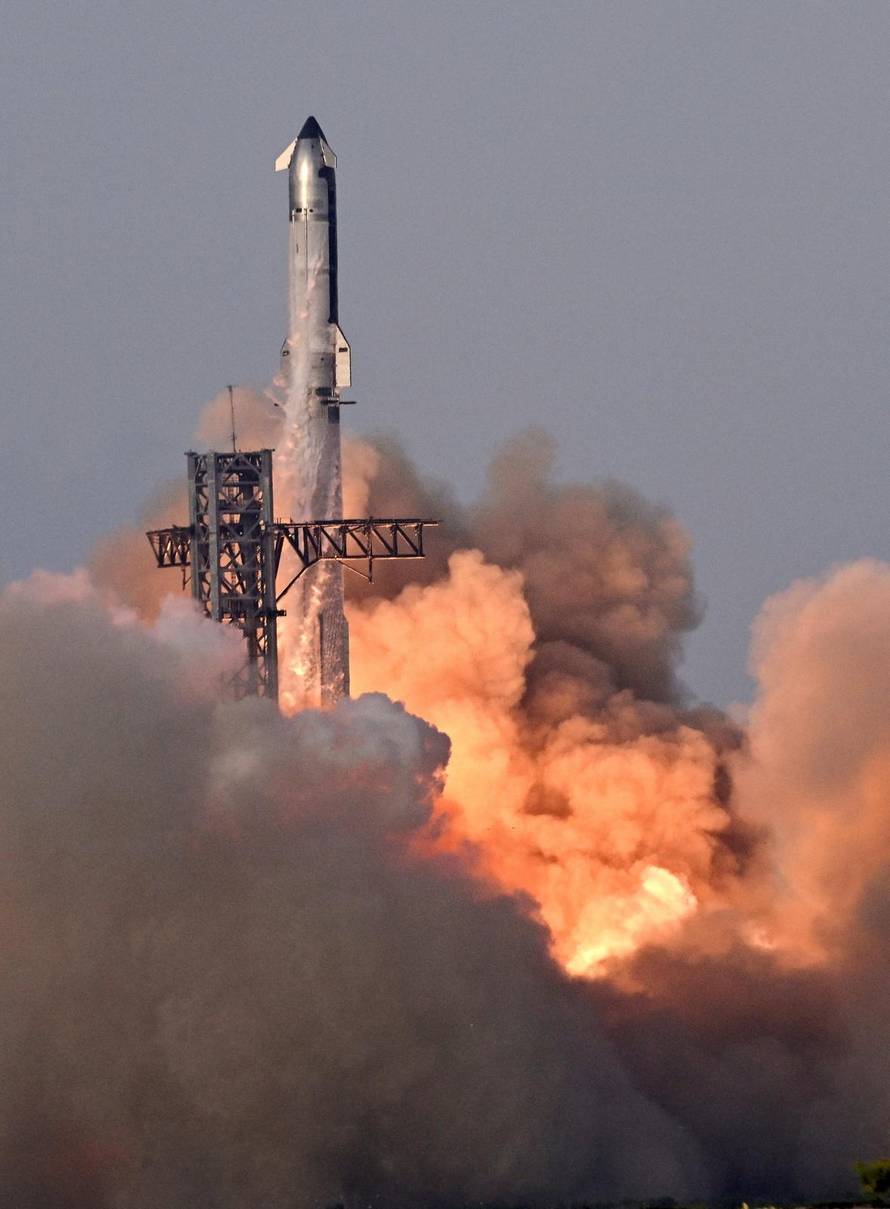 A SpaceX Super Heavy booster carrying the Starship spacecraft lifts off on its 10th test flight
