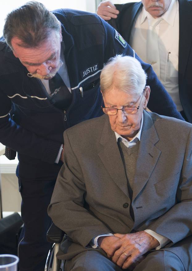 Defendant Hanning, a 94-year-old former guard at Auschwitz death camp, arrives for the continuation of his trial in Detmold