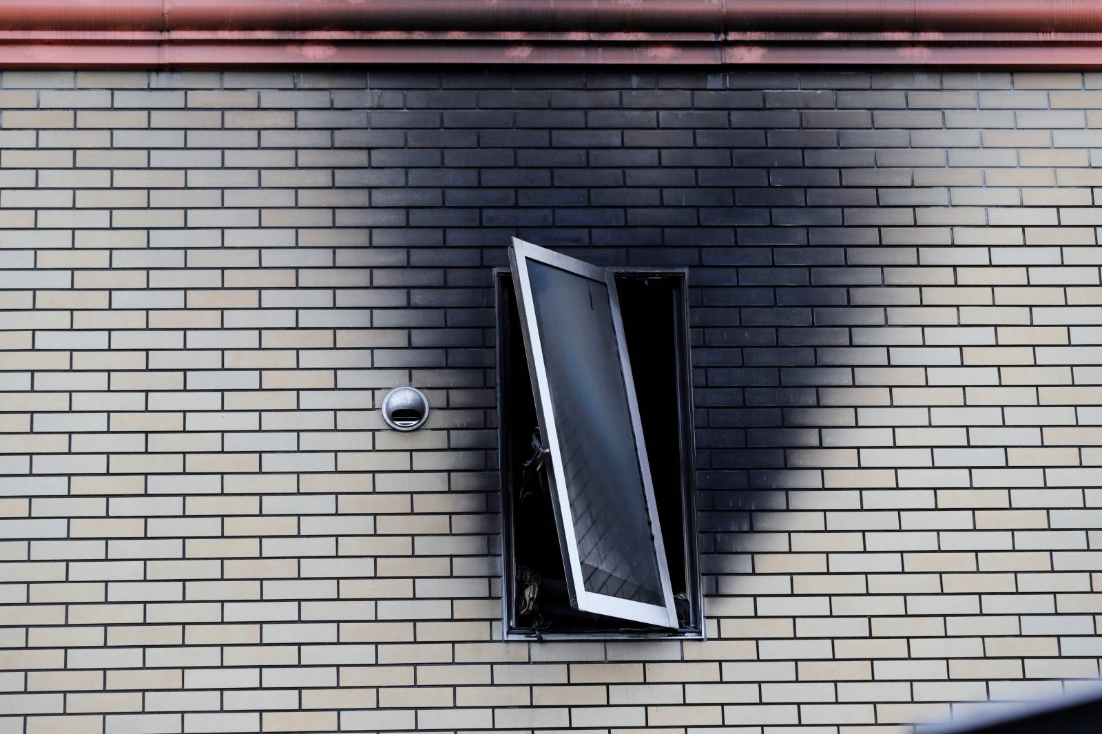 A window of Kyoto Animation building which was torched by arson attack is seen in Kyoto