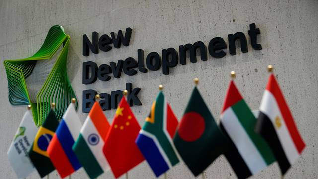 FILE PHOTO: A sign of the New Development Bank (NDB) is pictured at its headquarters in Shanghai