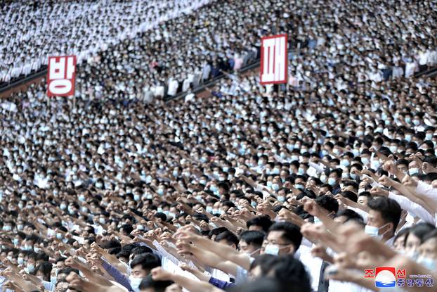 People attend a mass rally denouncing the U.S. in Pyongyang