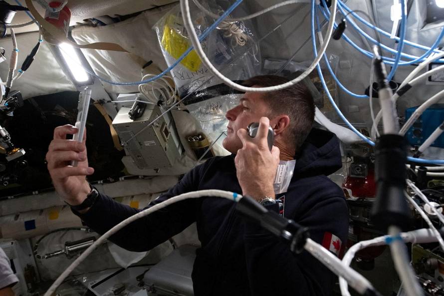 Artemis II mission specialist and CSA (Canadian Space Agency) astronaut Jeremy Hansen enjoys a shave inside the Orion spacecraft