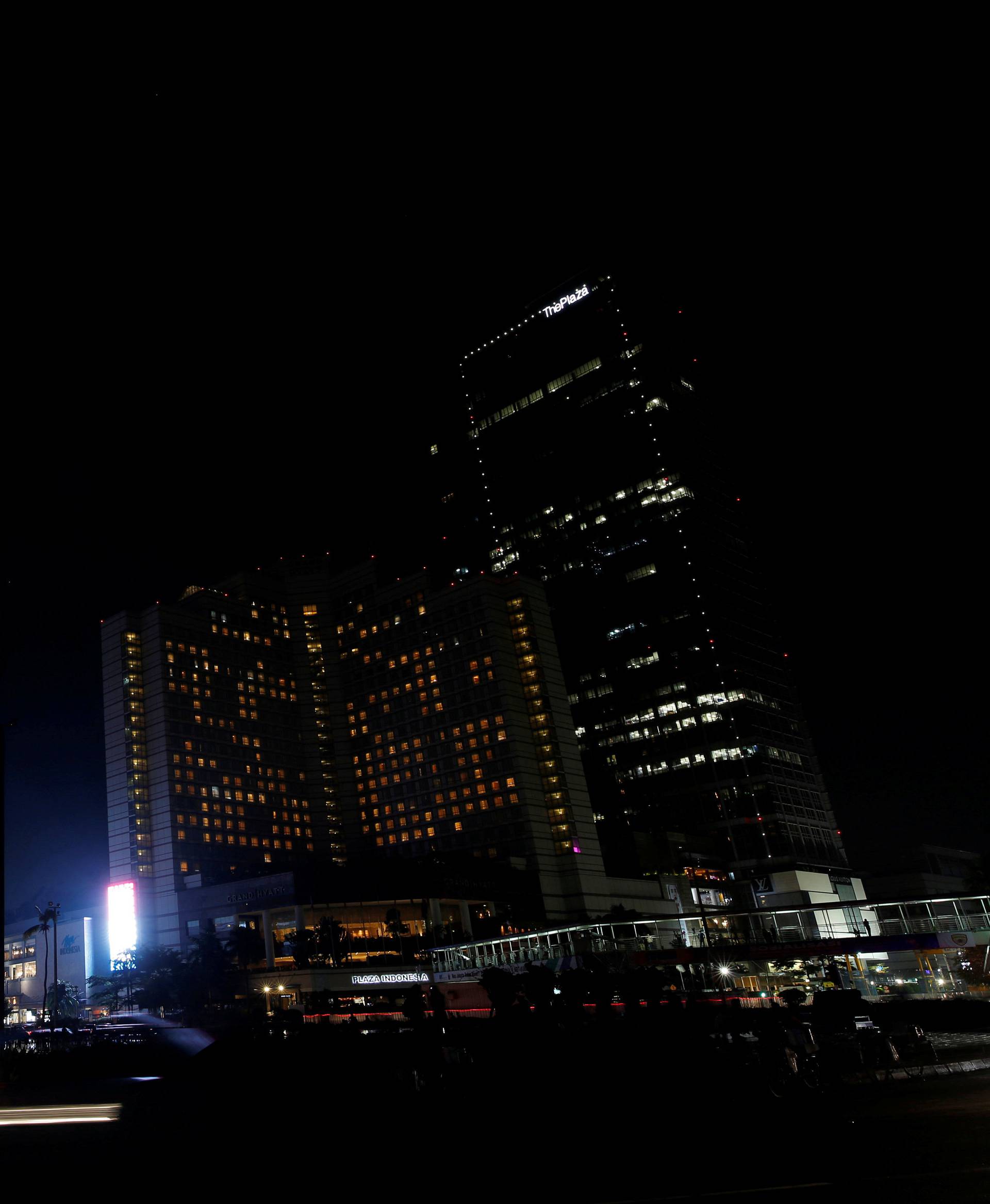 The area around Selamat Datang Monument, also referred to as the Bunderan HI roundabout, is pictured after the lights were switched off for Earth Hour in Jakarta