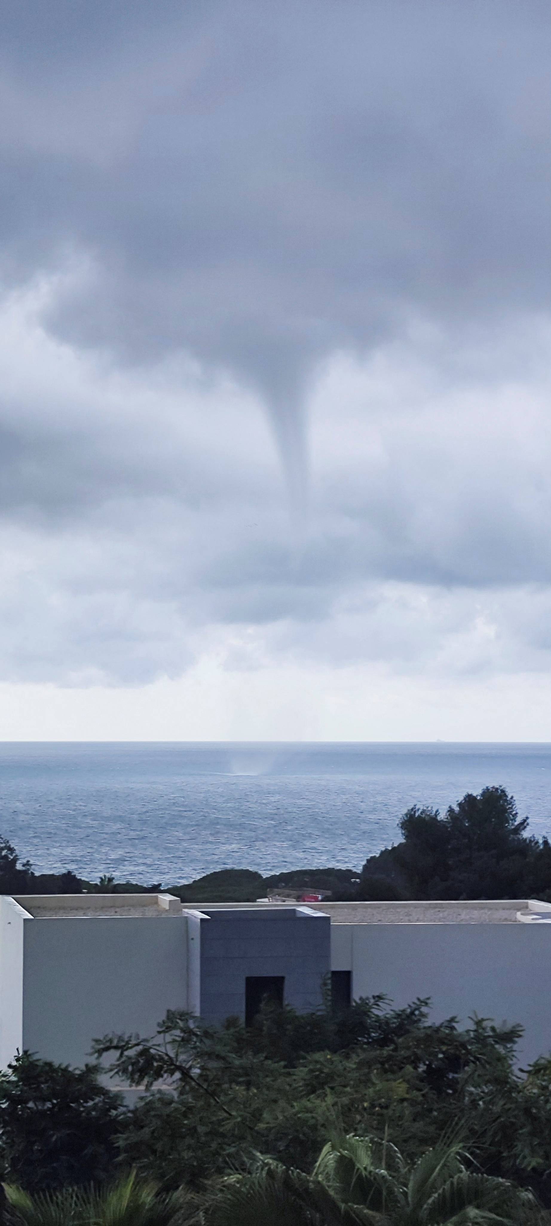 A waterspout forms over the sea, amid heavy rains in the region, in Mijas, Malaga