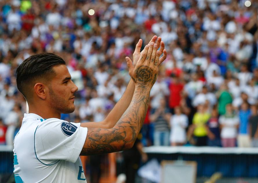 Real Madrid's new player Theo Hernandez acknowledges supporters during his presentation at the Santiago Bernabeu Stadium in Madrid
