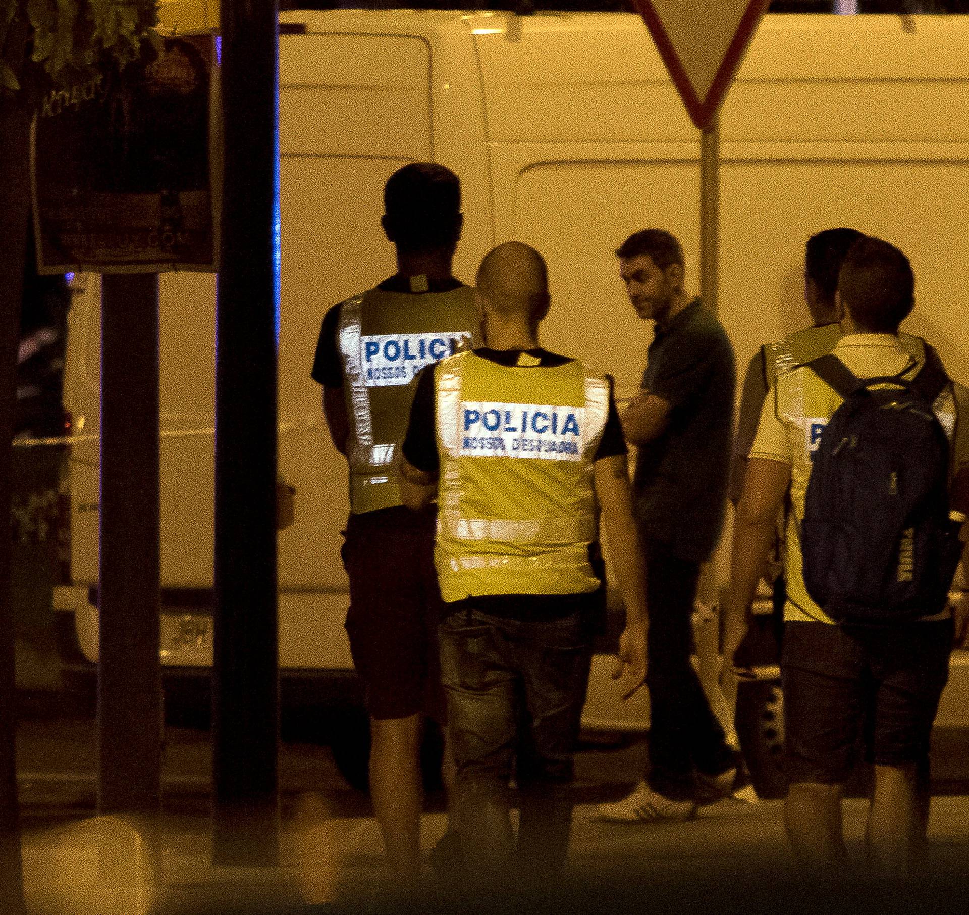 Police officers patrol near the scene where police had killed four attackers in Cambrils, south of Barcelona, Spain