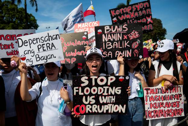 Filipinos gather during a protest denouncing what they call corruption linked to flood control projects