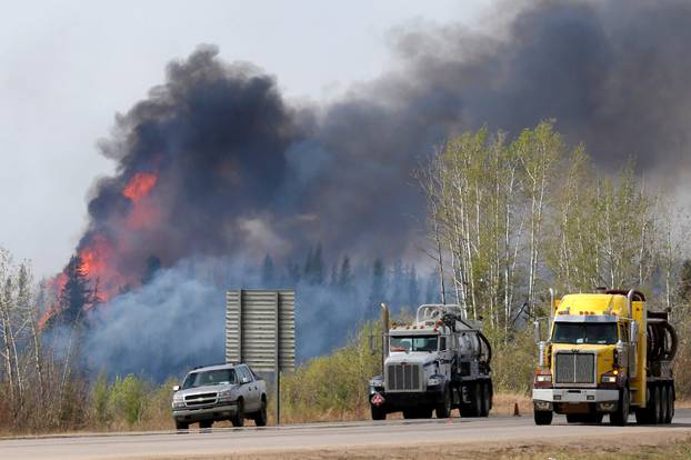 A wildfire burns near Highway 63 south of Fort McMurray