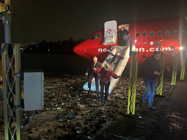 Passengers evacuate plane after it veered off runway in Norway