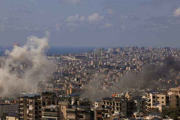 Smoke rises following an Israeli strike on the southern suburbs of Beirut
