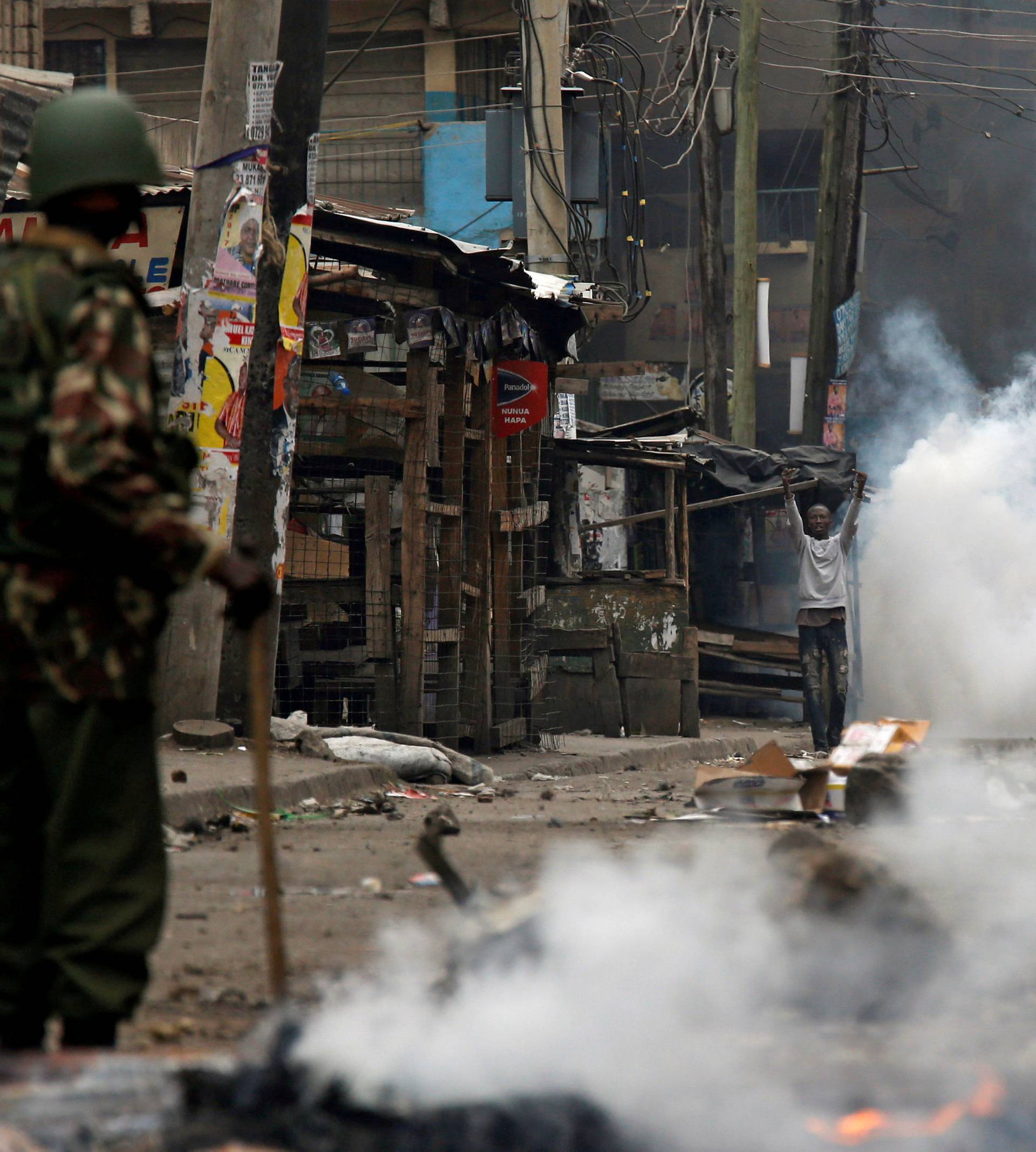 Anti riot policemen clash with protesters supporting opposition leader Raila Odinga in Mathare, in Nairobi