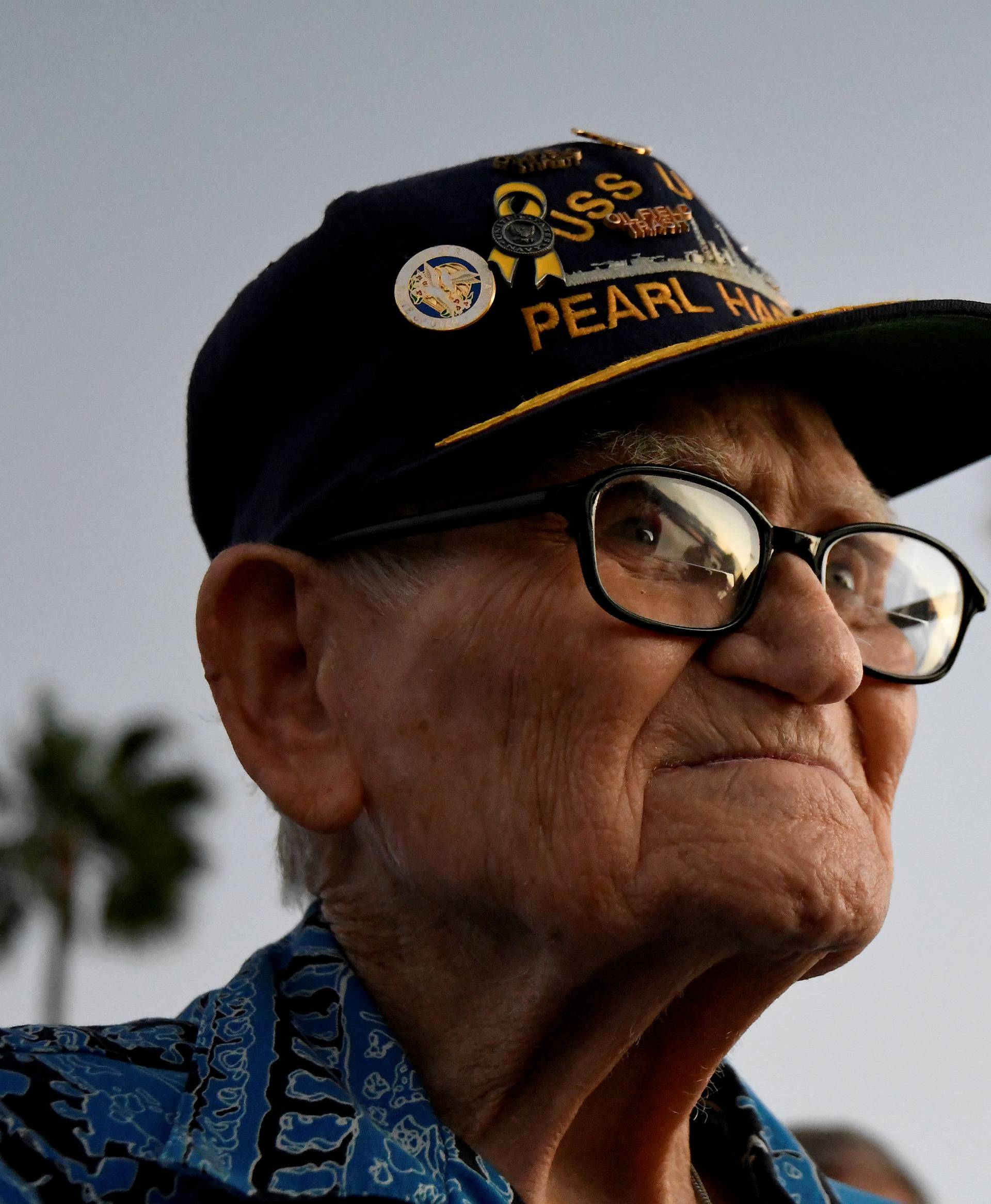 Pearl Harbor survivor Bill Hughes, who was aboard the USS Utah when it was attacked, arrives at a ceremony honoring the sailors of the USS Utah at the memorial on Ford Island at Pearl Harbor in Honolulu, Hawaii