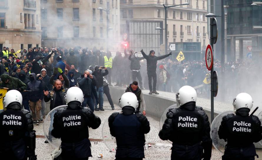 Far-right supporters face off with police during a protest against Marrakesh Migration Pact in Brussel