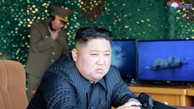North Korea's leader Kim Jong Un supervises a "strike drill" for multiple launchers and tactical guided weapon into the East Sea during a military drill in North Korea
