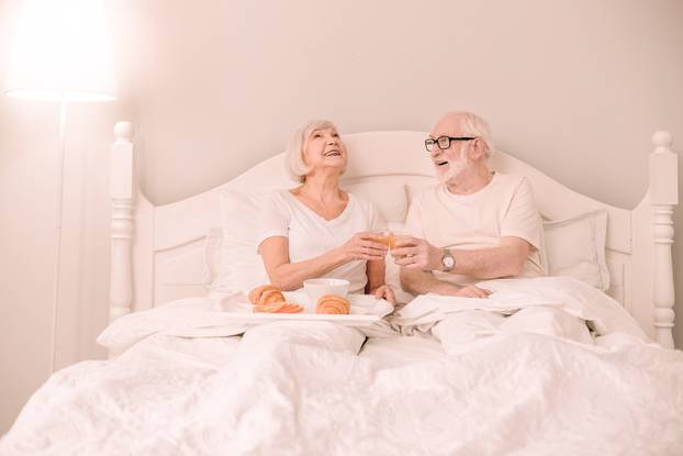 Happy blonde female person laughing at joke