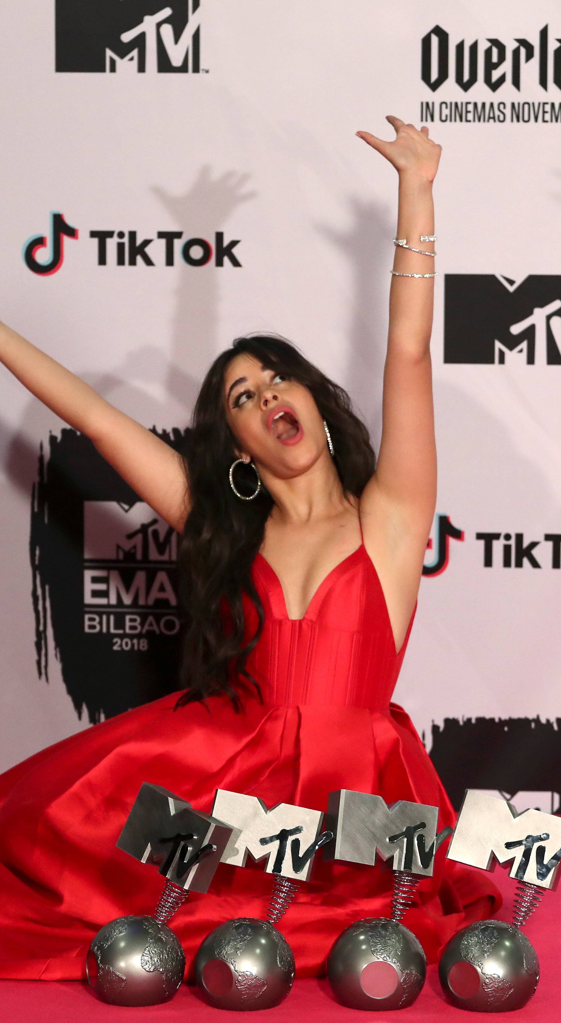 Camila Cabello poses with her awards during the 2018 MTV Europe Music Awards at Bilbao Exhibition Centre in Bilbao