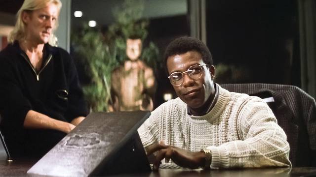 USA. Clarence Gilyard Jr.  in a scene from the ©Twentieth Century Fox movie : Die Hard (1988). 
Plot: An NYPD officer tries to save his wife and several others taken hostage by German terrorists during a Christmas party at the Nakatomi Plaza in Los Angele