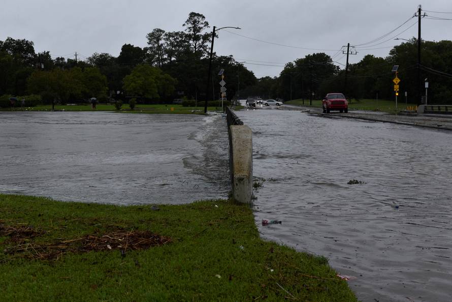 Brays Bayou flows over a bridge after Hurricane Harvey inundated the Texas Gulf coast with rain causing widespread flooding