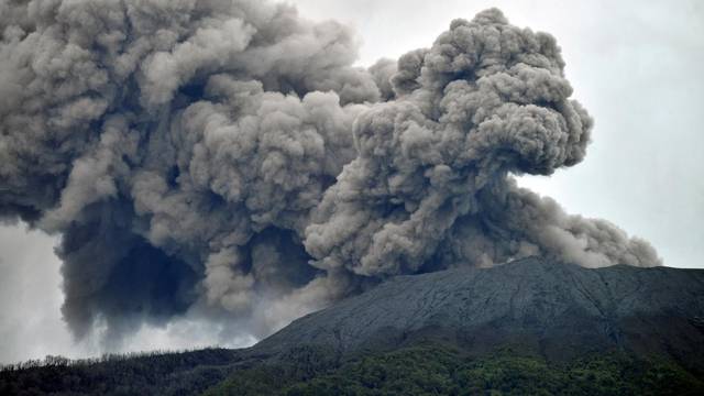 Mount Marapi volcano spews volcanic ash as seen from Nagari Batu Palano in Agam