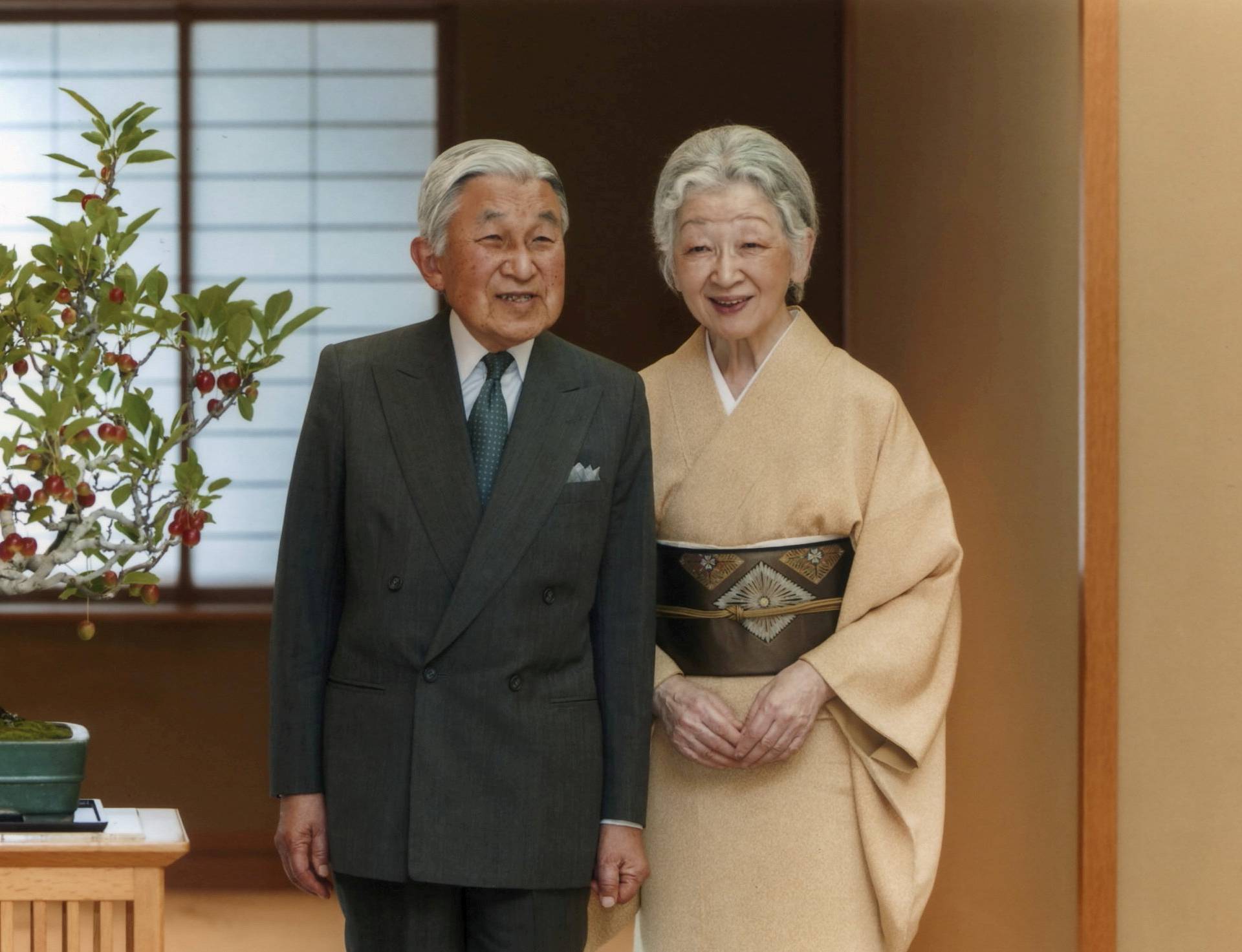 Japan's Emperor Akihito exchanges smiles with Empress Michiko at the Imperial Palace in Tokyo