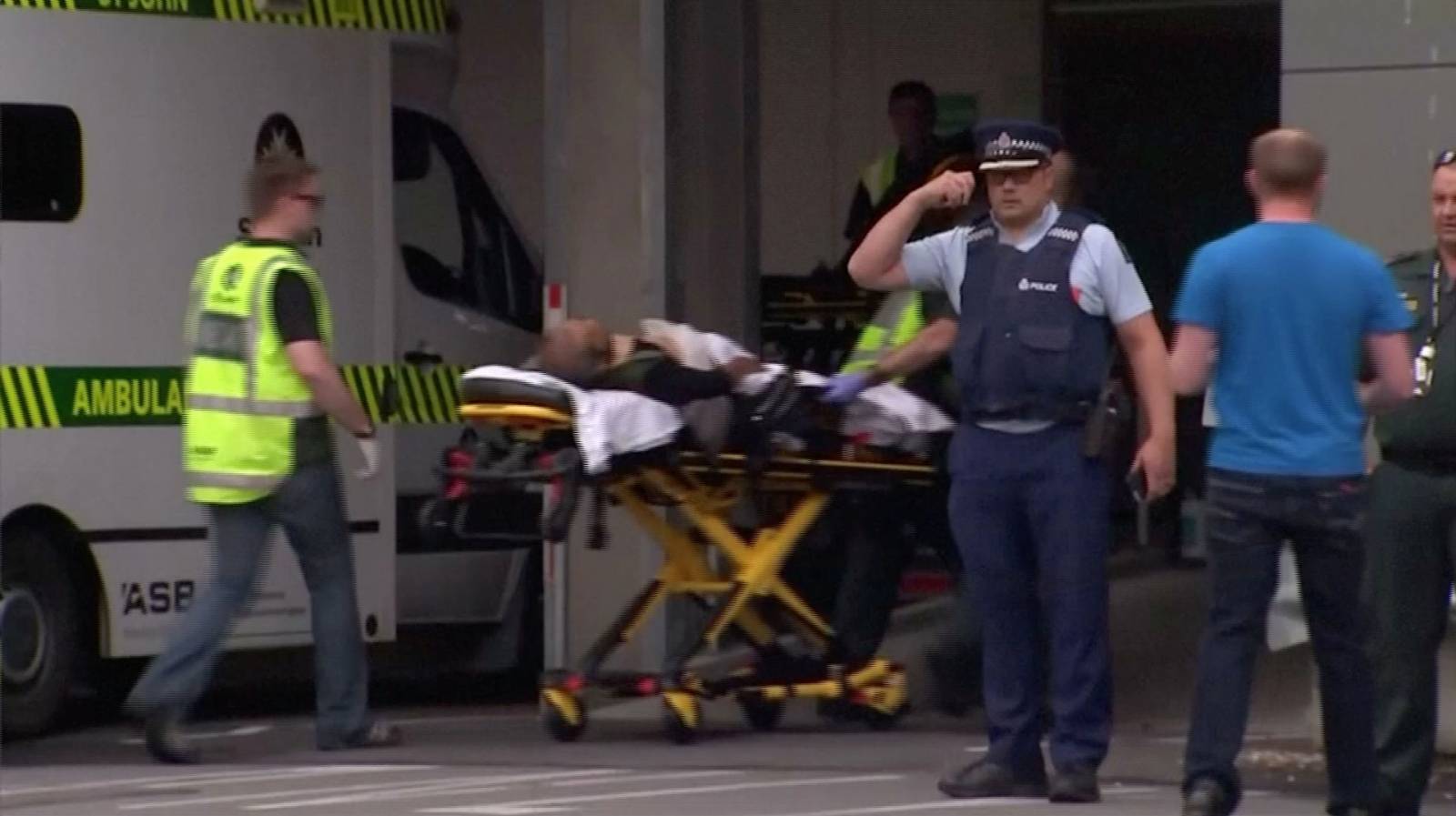 Video grab of emergency services personnel transport a stretcher carrying a person at a hospital, after reports that several shots had been fired, in central Christchurch