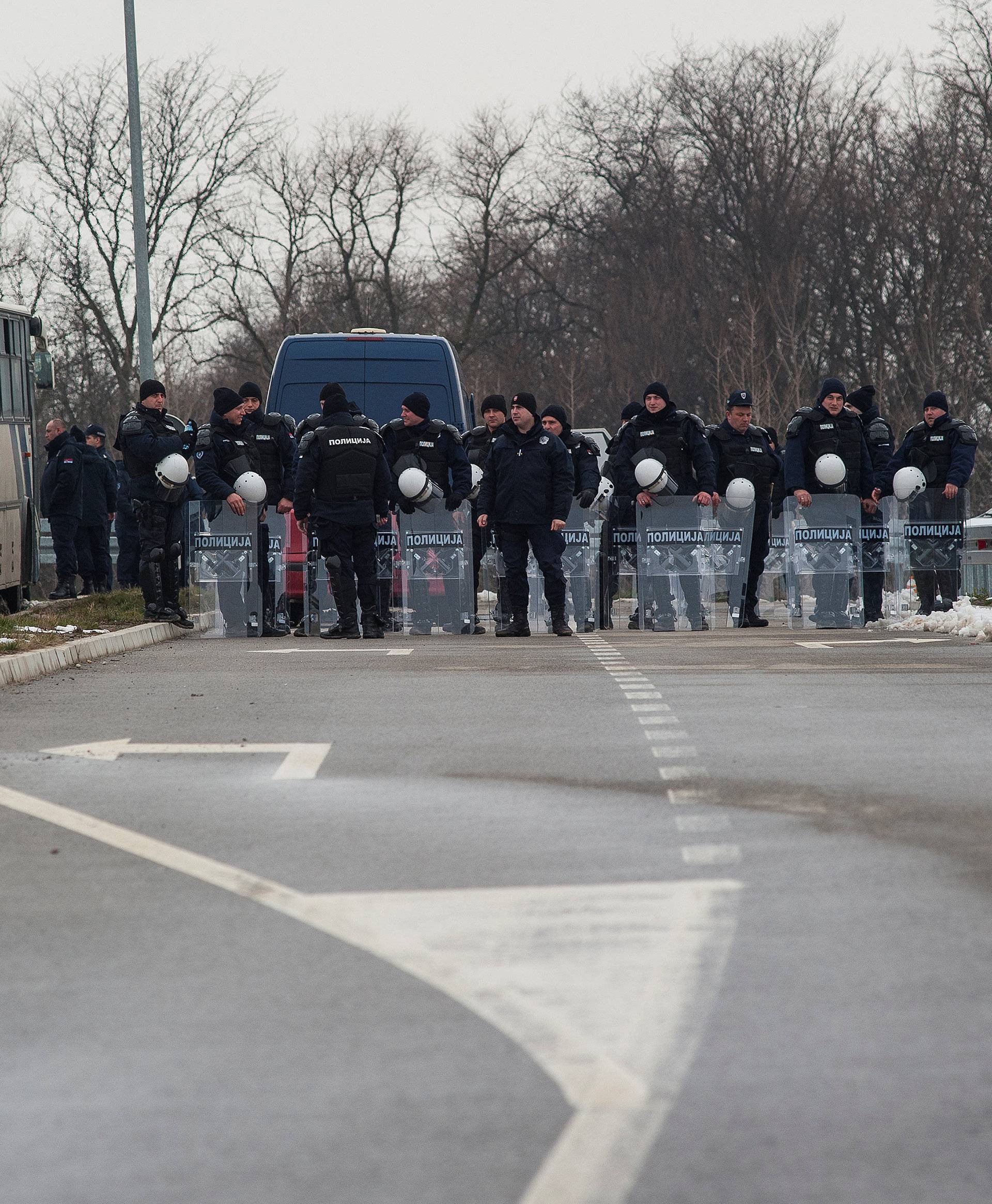 Police guard the road to the Kovilovo sport centre hosting the handball match between Serbia and Kosovo, in Belgrade