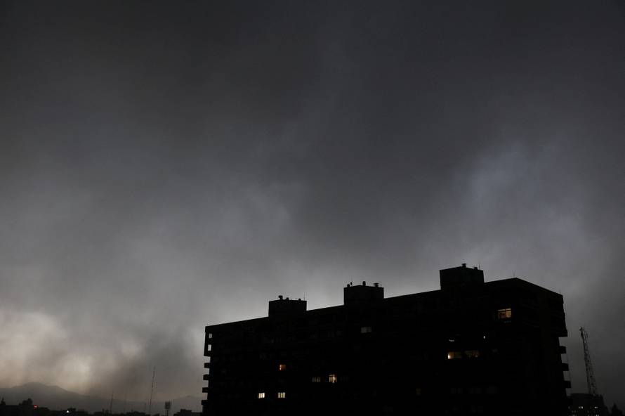 Smoke rises after a reported strike on fuel tanks at an oil refinery, amid the U.S.-Israeli conflict with Iran, in Tehran