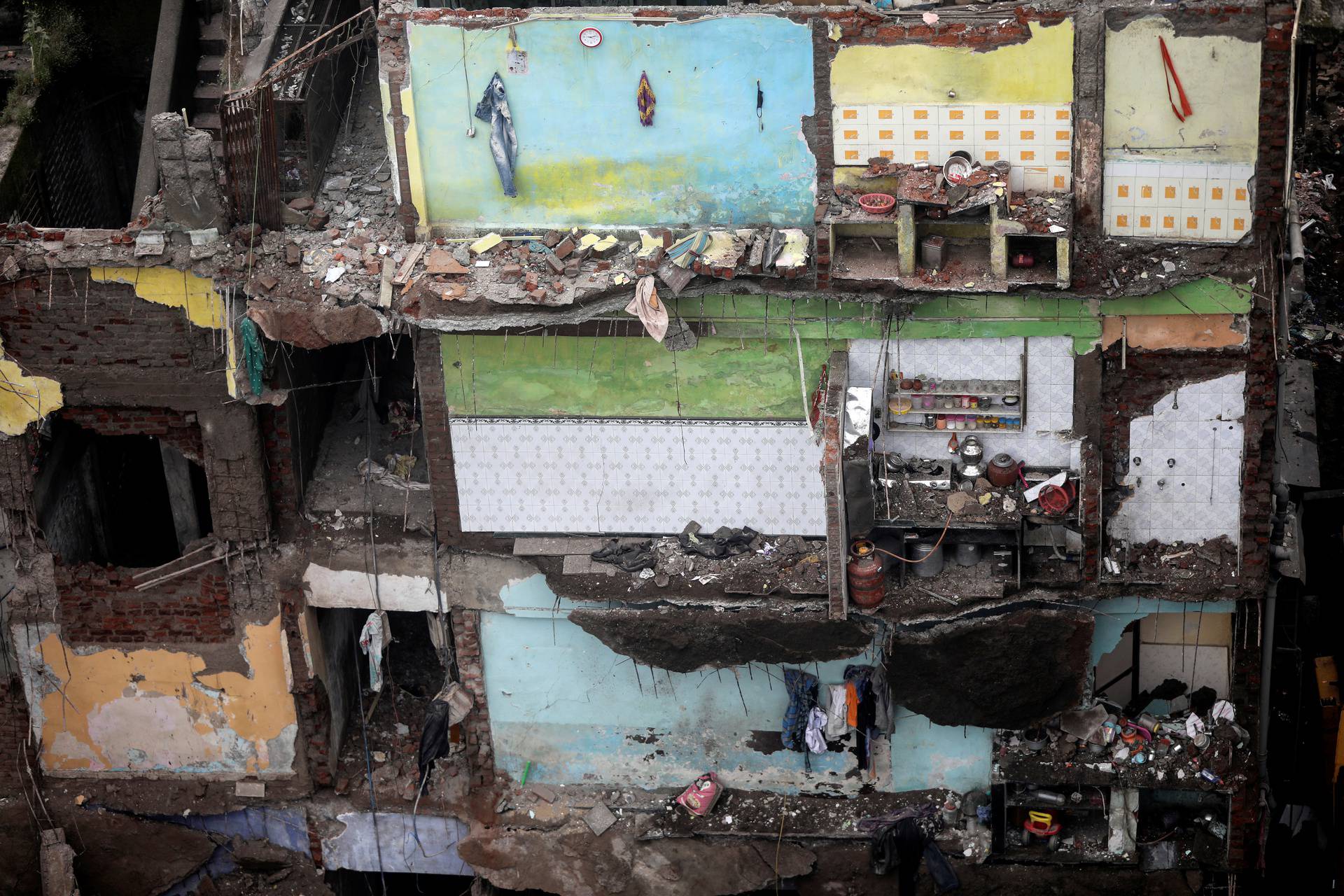 Exposed walls with household items still intact are seen after building collapse in Bhiwandi