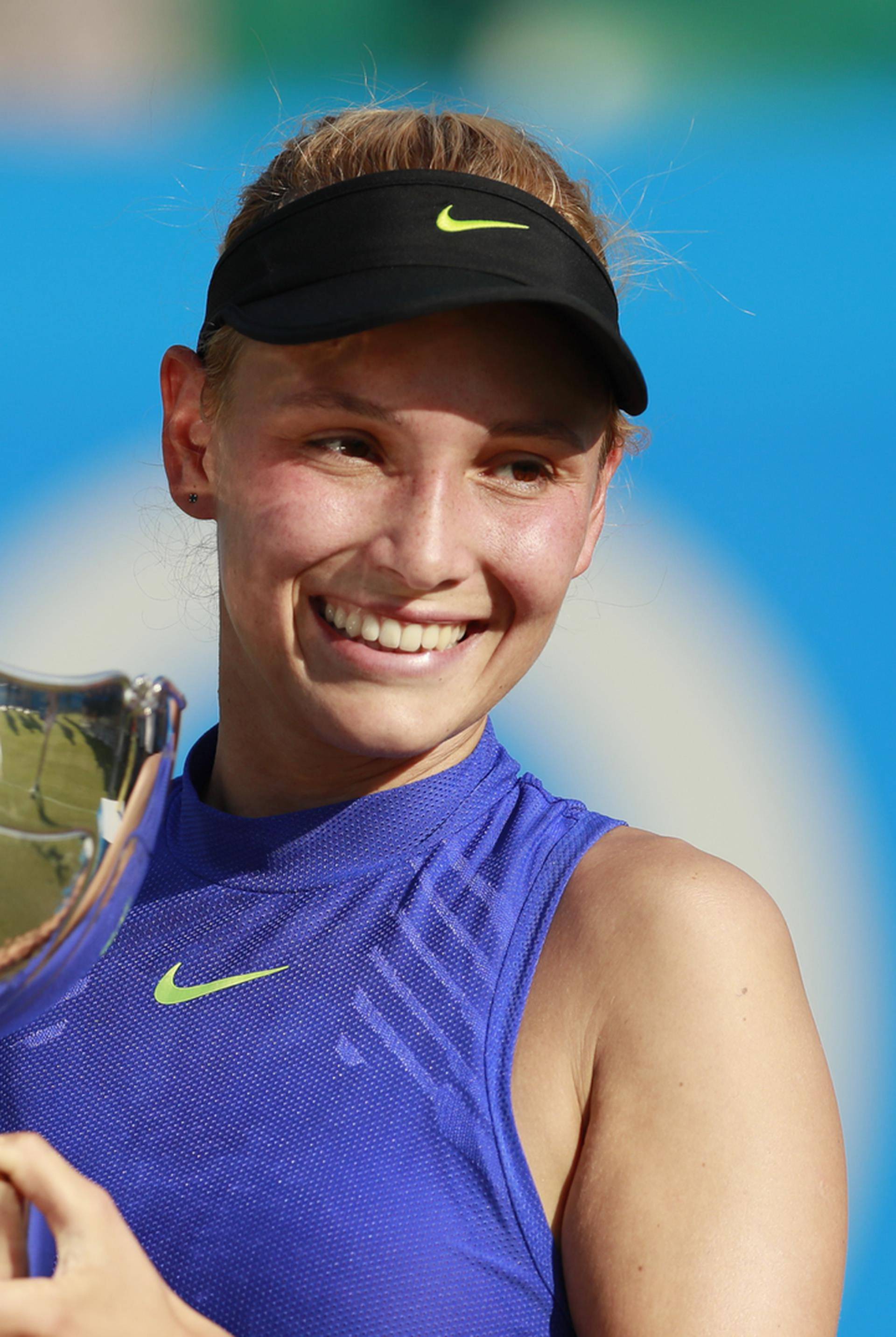 Croatia's Donna Vekic celebrates winning the final with the trophy