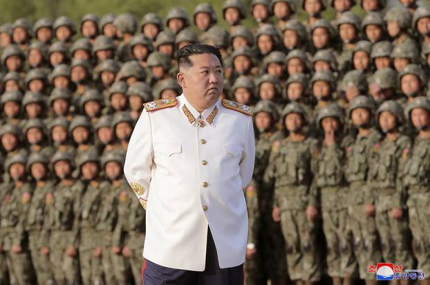 North Korean leader Kim Jong Un meets troops who have taken part in the military parade to mark the 90th anniversary of the founding of the Korean People's Revolutionary Army