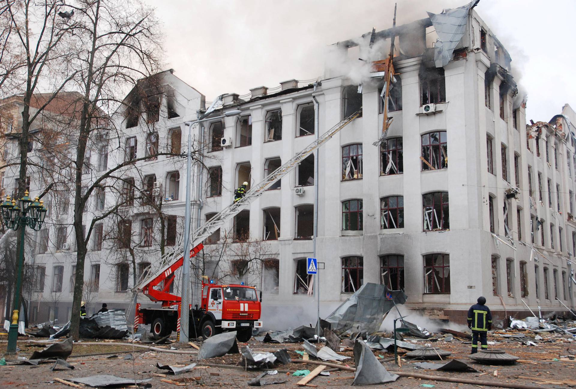 Firefighters work to extinguish a fire at the damaged building of the Kharkiv National University in Kharkiv