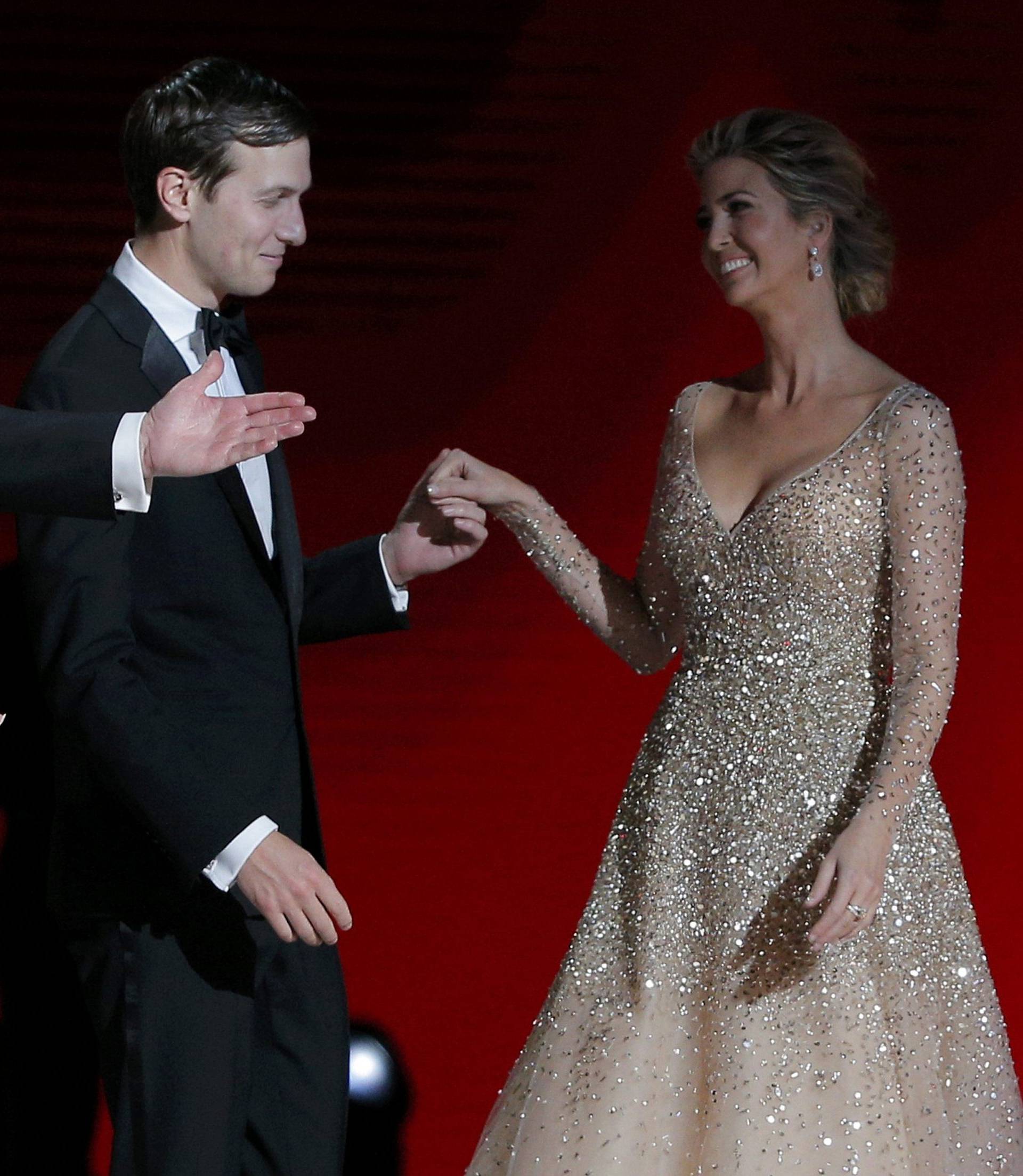 U.S. President Donald Trump and his wife first lady Melania Trump gesture towards his daughter Ivanka and her husband Jared Kushner at his "Liberty" Inaugural Ball in Washington