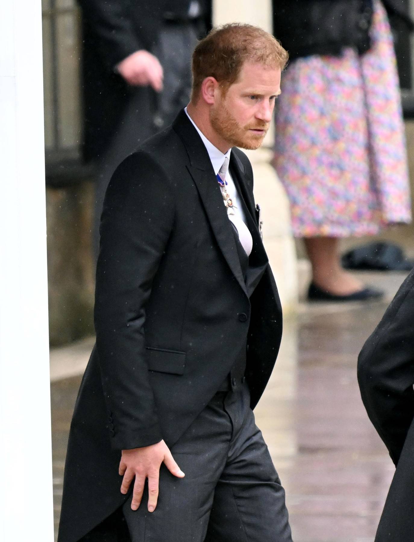 Prince Harry pictured departing Westminster Abbey after attending his father King Charles III Coronation.