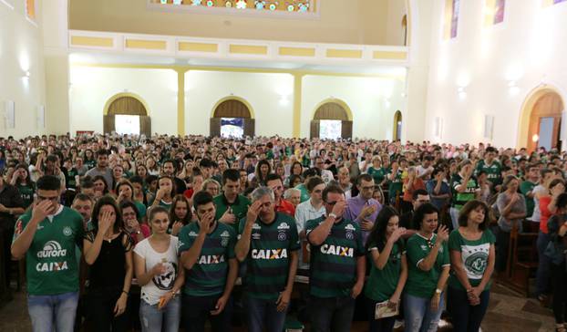 Fans of Chapecoense soccer team attend a mass at the Santo Antonio Cathedral in Chapeco