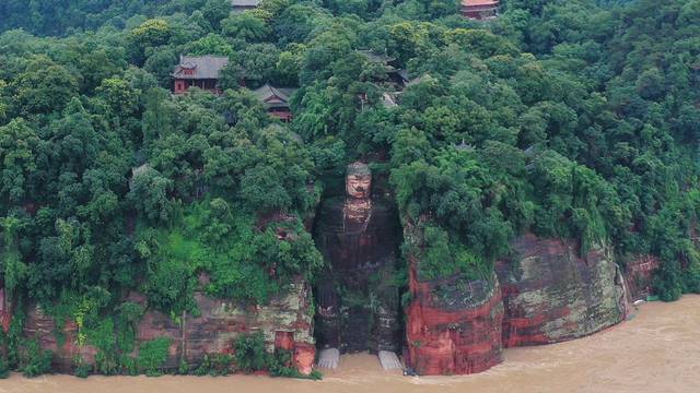 Floodwater reaches the Leshan Giant Buddha's feet following heavy rainfall, in Leshan, Sichuan
