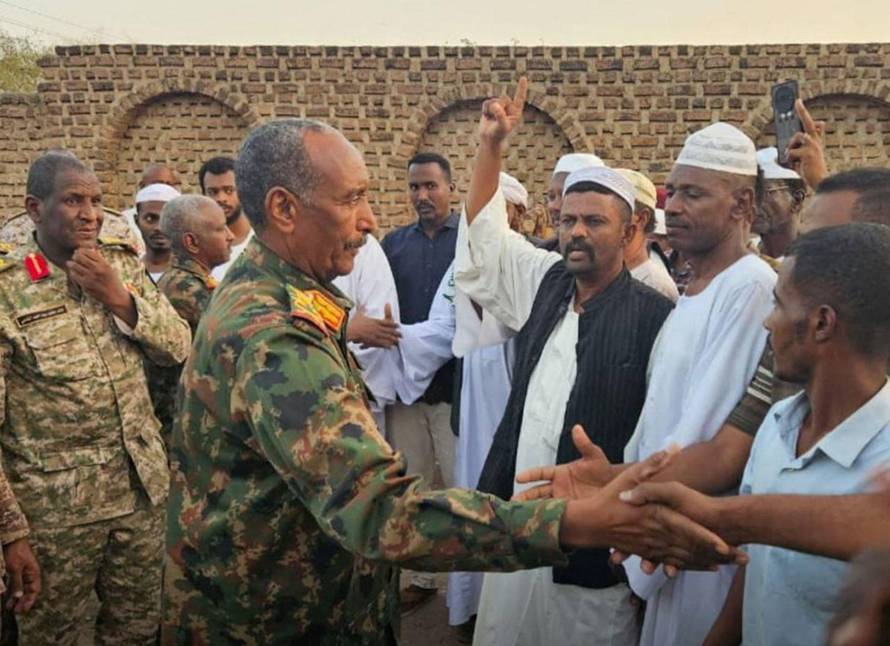 Sudan army chief, Abdel Fattah al-Burhan offers condolences to families of an officer and a journalist, who were killed during a battle with Rapid Support Forces (RSF) at the presidential palace in Khartoum, in the state of al-Gadarif