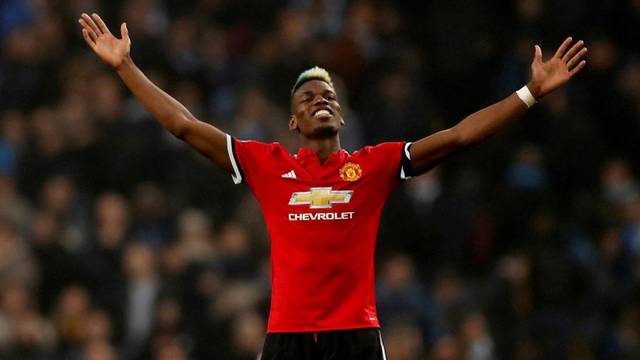 FILE PHOTO: Manchester United midfielder Paul Pogba celebrates after his match-winning display against rivals Manchester City at the Etihad Stadium