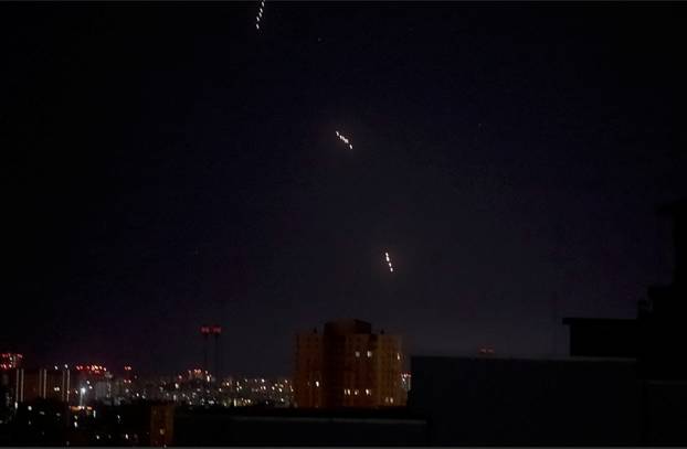 Russian missiles which appear to be the Oreshnik hypersonic ballistic missile, fly during a Russian missile and drone strike in Kyiv