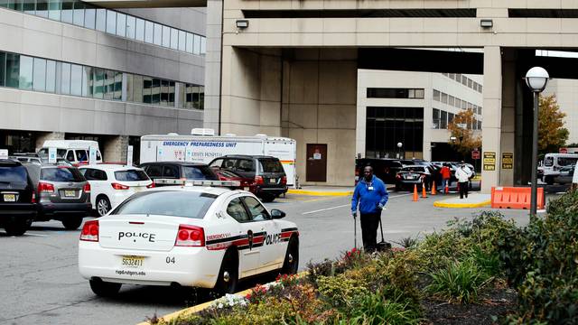 A police car is seen near the entrance of University Hospital where Ahmad Khan Rahimi has been recovering from gunshot wounds he suffered in a shootout with police before his arrest, in New Jersey