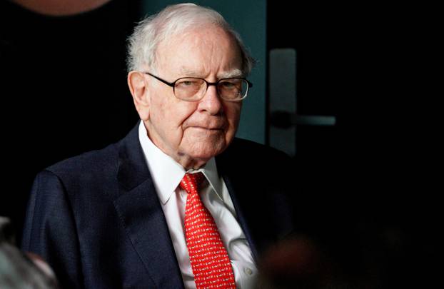 FILE PHOTO:    Warren Buffett, CEO of Berkshire Hathaway Inc, pauses while playing bridge as part of the company annual meeting weekend in Omaha