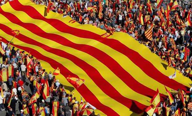 Pro-unity supporters take part in a demonstration in central Barcelona