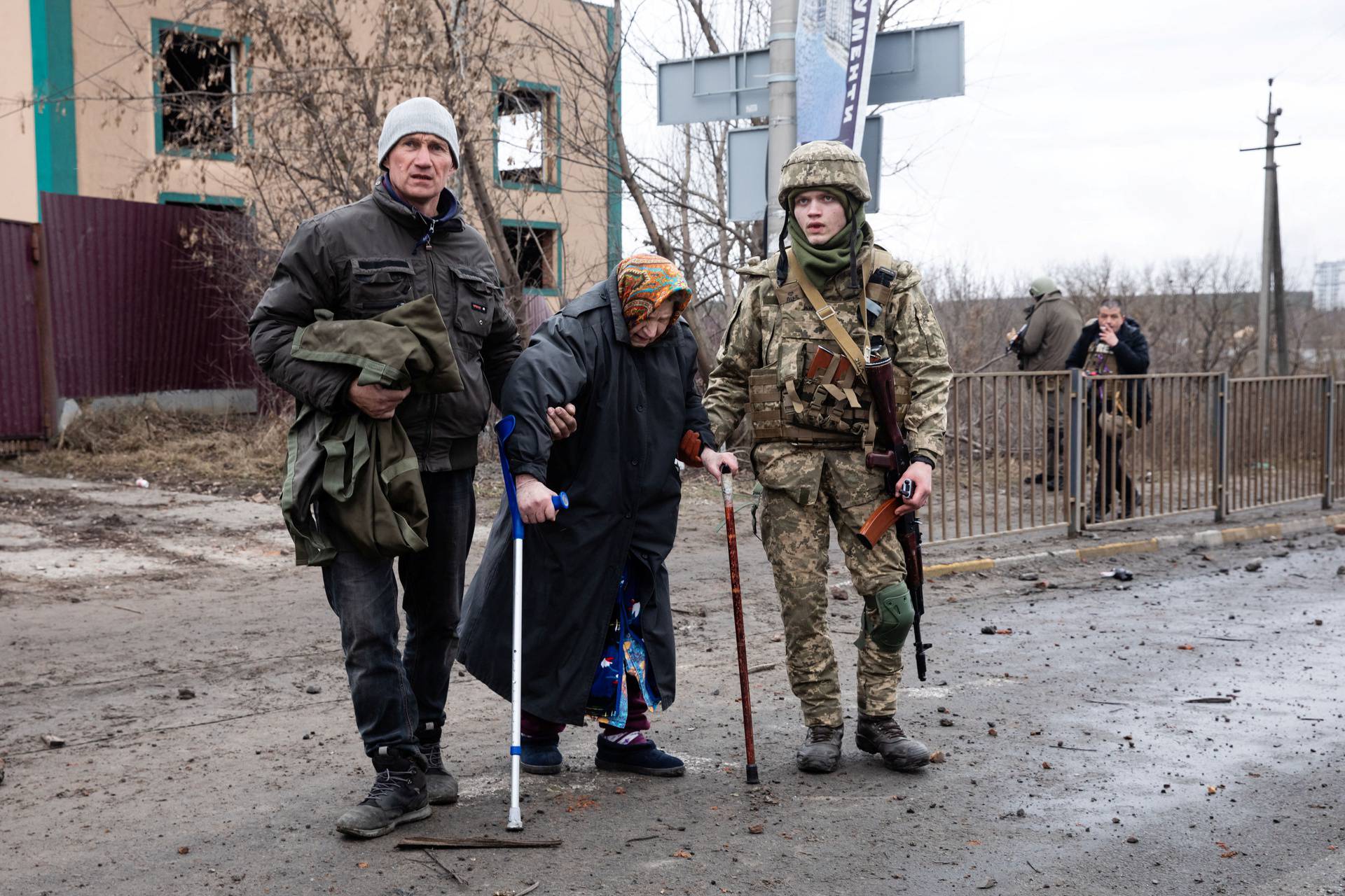Evacuees fleeing Ukraine-Russia conflict walk in the Kyiv region