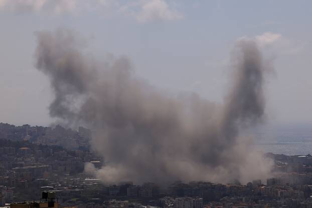 Smoke rises following an Israeli strike on the southern suburbs of Beirut