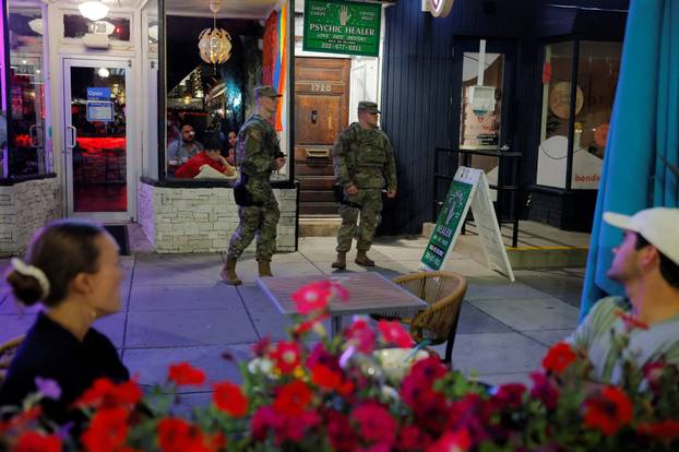 Members of the Ohio National Guard wear their sidearms while patrolling in Washington